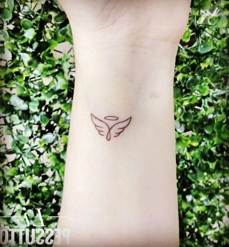 small-angel-wings-tattoo-wrist-tattoo-green-bushes-in-the-background Tattoo Angel, Tattoo Family, Angel Tattoos, Knight Templar, Shape Tattoo, Meaningful Tattoos For Women, Angel Wings Tattoo, Inspiration Tattoos, Small Meaningful Tattoos