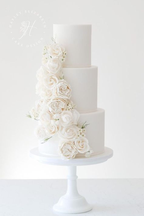 White wedding cake designs in Hampshire | elegant wedding cake by Hayley Elizabeth | wedding cakes elegant romantic | elegant white wedding cake | all white wedding cake classy | wedding cake with sugar flowers | all white wedding cake ideas | luxury wedding cake design | fine art wedding cake | white wedding | luxury white wedding #weddingcakes #whitewedding Buttercream White Wedding Cake, Romantic Wedding Cake 3 Tier, Simple Wedding Cake White Roses, Plane White Wedding Cake, All White Wedding Cake With Flowers, White Wedding Cake With Roses, His And Her Cake Wedding, Stunning Wedding Bouquets, White Wedding Cake White Flowers