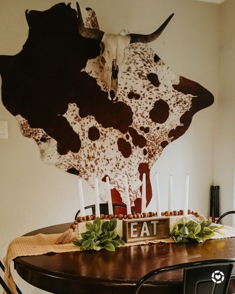 Cow Hide Decor Wall, Texas Theme Decor Living Room, Cowhide Above Bed, Cowhide Hanging On Wall, Decorate With Cowhide Rug, Cowhide Wall Hanging, Cowhide On Wall Ideas Bedroom, Cow Hide On The Wall, Cowhide On Wall Ideas Living Room