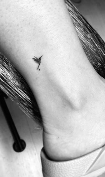 Tiny Bird Tattoos For Women Finger, Mini Bird Tattoos For Women, Microrealism Hummingbird Tattoo, Tiny Tattoos Hummingbird, Small Hummingbird Tattoo Ankle, Micro Tattoo Hummingbird, Micro Memorial Tattoo, Dainty Peacock Tattoo, Tiny Delicate Tattoos For Women