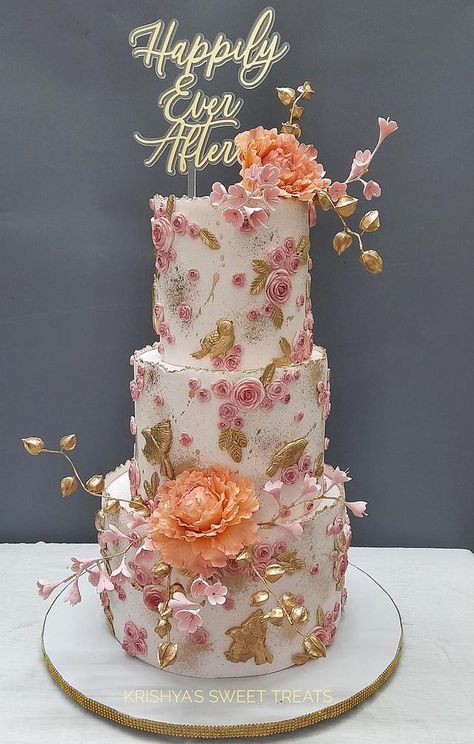 A three tiered wedding cake. Three Tier Cake Design, Big Bday Cake, Birthday Cake 3 Tier, Three Tier Cake Birthday, Floral Theme Cake, Engagement Cake Decorations, 3 Tier Birthday Cake, Castle Wedding Cake, Art Deco Wedding Cake