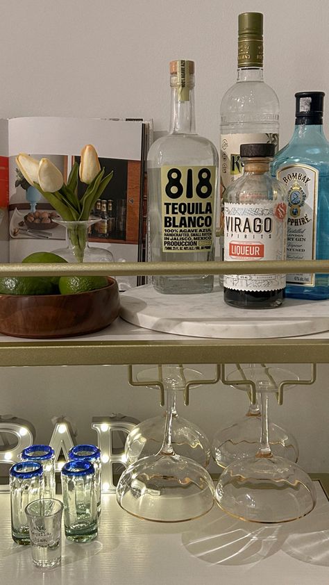 bar cart book gold amazon layout couple glasses liquor liqueur shot glasses bar back lights coffee table books Bar Cart Shot Glasses, Bar Cart Books, Tequila Bar Cart, Bar Cart Inspo College, Bar Cart Glasses, Cute Bar Carts, Shot Glasses Aesthetic, Bar Cart Set Up, Bar Cart Ideas Apartments