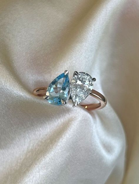 aquamarine and diamond toi et moi ring with an 18k yellow gold band Toi Et Moi Ring Aquamarine, Aquamarine Diamond Ring, Toi Et Moi Sapphire Ring, Aquamarine And Diamond Ring, Wedding Ring Goals, Pretty Wedding Rings, Aquamarine Wedding Ring, Perfect Symmetry, Symbols Of Love