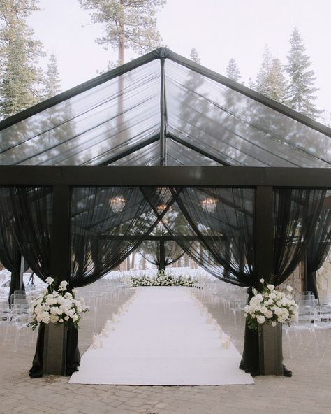 Discover why Hensley Event Resources is California’s leading tenting company! Our stunning black tent, showcased at the Lake Tahoe Ritz Carlton for an unforgettable wedding ceremony, sets the perfect scene. Make your event as iconic as this! #HensleyEventResources #CaliforniaWeddings #LakeTahoeWeddings #EventTenting #event #eventdesign #weddingphotography #glasshouse #weddingplanner #eventplanner #eventdecor #architecture #sanfrancisco #snow #laketahoe #ritzcarlton #blackandwhite Planning... Black Ceremony Arch, Black Wedding Tent, Black Tent Wedding, Black Wedding Aisle, Outdoor Wedding Black, Black Ceremony, Black Gazebo, Gazebo Wedding Ceremony, Glasshouse Wedding