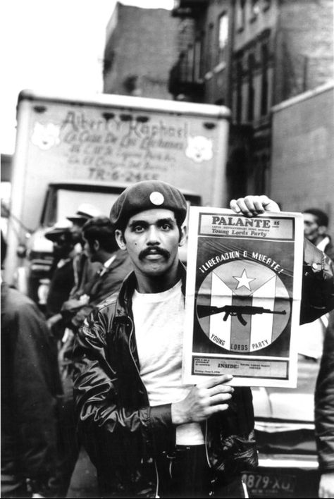 The Lords’ history began as a struggle for Puerto Rican independence and racial equality. This photograph, titled "David with Palante, V. 2, N. 4," is on view at El Museo del Barrio.  Photo credit: Hiram Maristany Library Artwork, Chicano Studies, Puerto Rican People, East Harlem, Puerto Rico History, Puerto Rico Art, Hammer And Sickle, Puerto Rican Culture, Protest Art