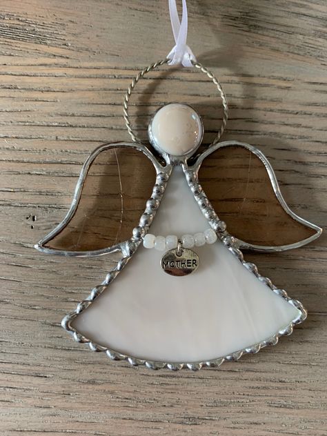 "This listing is for 1 Stained Glass Angel Ornament with a personalized charm. The angel is made with opalescent and translucent champagne color glass. The charm choices are mother. grandma, daughter, sister and aunt. Each angel will come in a gift box with a suction cup. If you need a different color please message to see if available. 💜STAINED GLASS Every piece of glass has its own unique pattern and color variation. Please note that there may be slight variations in each piece. Each piece is Stained Glass Angel Ornaments, Stained Glass Memorial, Angel Stained Glass Patterns, Stained Glass Angels, Angel Suncatcher, Glass Suncatchers, Stained Glass Angel, Glass Diy, Broken China Jewelry