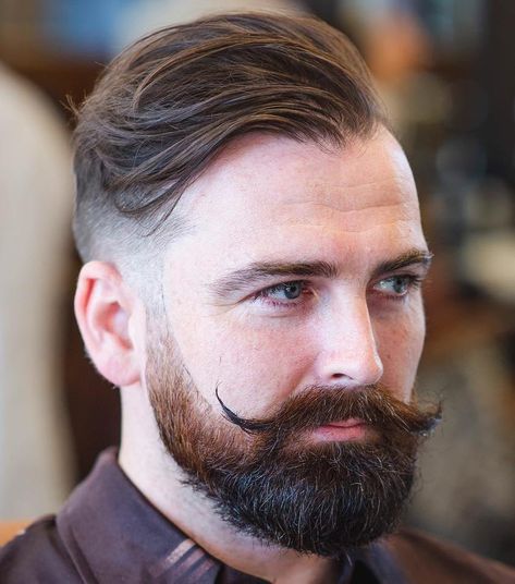 Undercut with Beard and Handlebar Moustache Undercut With Beard, Haircuts For Balding Men, Mens Modern Hairstyles, Balding Mens Hairstyles, Hairstyles For Receding Hairline, Hairstyle App, Handlebar Mustache, Popular Mens Hairstyles, Mustache Styles