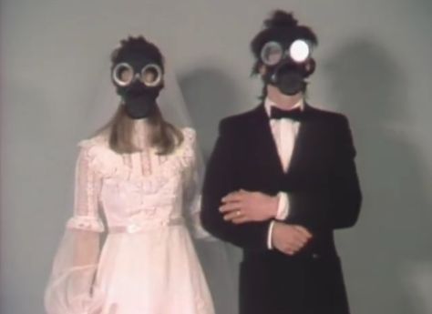 Love stinks Gas Masks, Two People, Wall