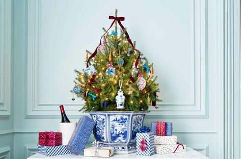 Small-space living calls for thinking outside of the box. Here are small Christmas tree ideas that deliver big holiday cheer. Small Christmas Tree Ideas, Chinoiserie Christmas Tree, Blue Christmas Stocking, Blue And White Bowl, Colorful Christmas Decorations, Christmas Place Settings, Blue Christmas Ornaments, Chinoiserie Christmas, Blue Christmas Decor