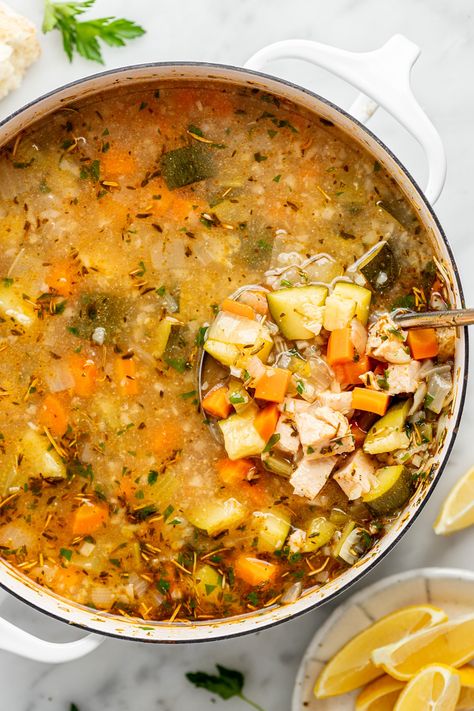 This Lemony Chicken & Vegetable Soup has become our family's new feel-good meal. Bright, flavorful, filling, full of protein from cooked chicken + rocking 5(!) different vegetables (onion, carrots, celery, zucchini + frozen riced cauliflower). Made on the stovetop in one pot in under 30 minutes, it is such a comforting dinner that warms you up from the inside out. Lemon Chicken Vegetable Soup, Veggie And Chicken Soup, Chicken And Rice Vegetable Soup, Zucchini Chicken Soup, Carrot Soup Recipes Healthy, Uni Meals, Chicken And Vegetable Soup, Natural Nurturer, Veggie Soup Recipes