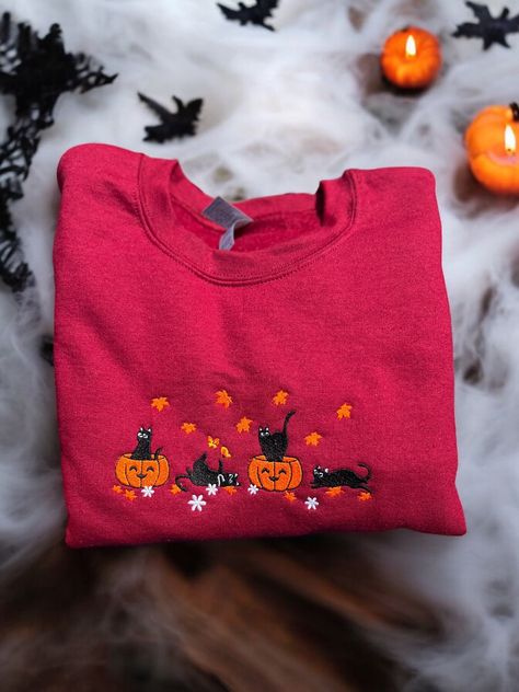 cat sweater, halloween crewneck, fall sweatshirt, halloween sweatshirt, fall crewneck, womens sweatshirt, embroidered sweater, kitten shirt This cat sweatshirt is the perfect way to add some comfort and style for your fall wardrobe.  Embrace the sweater weather cozy season with my handmade embroidered sweatshirts. Cute sweatshirt is embroidered with love and special care to detail.  Makes a great fashion staple for halloween. **Materials** Made with a soft fleece lined sweatshirt, 50% polyester, Cute Halloween Sweaters, Crewnecks For Women, Funky Sweaters, Big Comfy Sweaters, Tshirt Inspiration, Sweatshirts Cute, Fall Crewneck Sweatshirt, Fall Crewneck, Halloween Crewneck