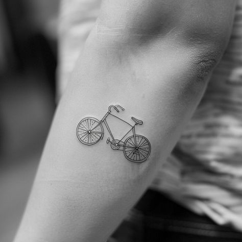 Discover the elegance of simplicity with this intricate, minimalist bicycle tattoo symbolizing freedom, adventure, and the joy of life's journey. Save this inspiration and follow for more unique designs. In this close-up, every fine line and curve breathes a vintage charm into the wearer's forearm, transforming skin into a canvas of personal expression. Let this be the ride into your next artistic venture. #MinimalistTattoo #BicycleDesign #VintageCharm #InkInspiration #BodyArt # Fine Line Bicycle Tattoo, Tattoo Bicycle, Jewlery Tattoo, Bike Tattoo, Dutch Bicycle, Bicycle Tattoo, Tattoo On Forearm, Bike Tattoos, Minimalist Vintage