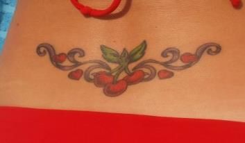 My cherry tattoo! Cherry Lower Back Tattoo, Cherry Tramp Stamp Tattoos, Cherry Vine Tattoo, Cherry Tramp Stamp, Trashy Tattoos, 2000s Tattoos, Cheetah Tattoo, Ivy Tattoo, Lower Back Tattoo