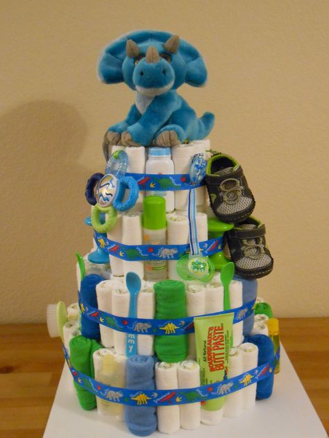 Diaper Cake - Dino cake! Dinosaur Baby Shower Theme, Unique Diaper Cakes, Baby Shower Checklist, Diaper Cake Centerpieces, Baby Shower Gift Bags, Diaper Cake Boy, Baby Shower Crafts, Baby Shower Diaper Cake, Boy Diy