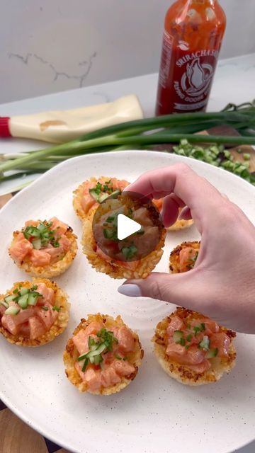 Victoria Minell on Instagram: "CRISPY RICE SUSHI CUPCAKES 🔥 with spicy salmon, cucumber & chives. Full recipe below:

Ingredients:
- 1 cup sushi rice 
- 200g sashimi grade salmon 
- 1 tbsp kewpie mayo
- 1 tbsp sriracha mayo
- 1/2 cucumber finely chopped
- 1 tbsp chives finely chopped
- Olive oil spray

Method:
1. Preheat oven to 200 degrees celsius and cook sushi rice to packet instructions
2. Spray a muffin tray with oil and place 1 heaped tablespoon of rice in each slot. Use a small espresso cup to push the rice down into a cup-like shape. Place in the oven for 30 minutes or until crispy
3. Slice the salmon into small cubes and mix with kewpie mayo and sriracha
4. Once the crispy rice cupcakes are cooked, Fill with the salmon mixture and top with cucumber and chives" Rice Cupcakes, Crispy Rice Sushi, Cook Sushi Rice, Sushi Cups, Sushi Cupcakes, Salmon Cucumber, Chives Recipe, Cottage Cheese Breakfast, Rice Sushi