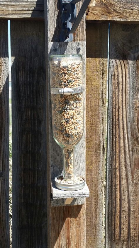 Wine bottle and pallet wood bird feeder Bottle Bird Feeder Diy, Bird Feeder With Bottle, Scrap Wood Bird Feeder, Glass Bottle Bird Feeder, Winebottle Bird Feeder, Wine Bottle Bird Feeder, Bird Cage Centerpiece, Wood Bird Feeder, Love Birds Painting