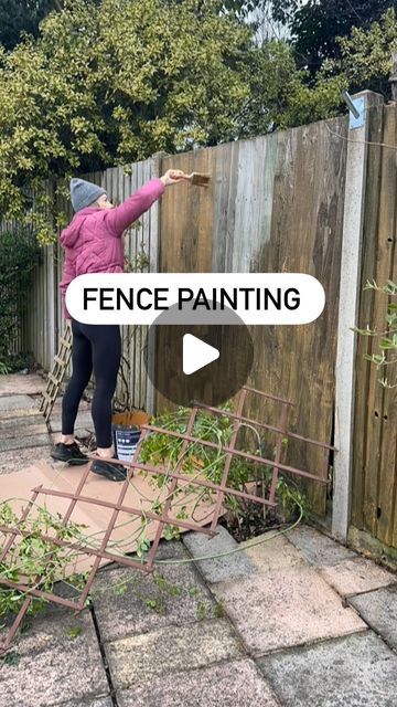 Lisa on Instagram: "ad | Our patio fence is ancient & really sun bleached and although a lot of it is hidden by plants, we wanted to give it a quick upgrade to create a nicer backdrop for the greenery.   We don’t want to replace the fence until we do the kitchen extension and redo the entire patio area next year, so this shed & fence paint from Fortress is the perfect budget friendly solution for now.   I did 2 coats in the shade Golden Oak. The wood soaked up the first coat as the fence panels are so old, but I went heavier on the second coat and the colour came through. I think it will look better again once it weathers just slightly, but the golden hue is much better than the washed-out grey timber.   It didn’t take that long to do with the brush, although the plants were a pain to pain Paint Wooden Fence, Painted Backyard Fence, Garden Fence Colours, Fence Painting Ideas, How To Stain Old Wood Fence, How To Fix Old Wooden Fence, Cat On Fence Painting, Fence Paint Colours, Old Fence Wood