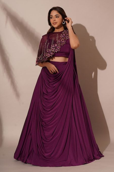 Buy Purple Lycra Embellished Sequins Solid Lehenga Saree Asymmetric Cape Set For Women by Chaashni by Maansi and Ketan Online at Aza Fashions. Shrug Lehenga Designs, Unique Lehenga Blouse Designs, Ethnic Lehenga Designs, Lehangas For Sisters Wedding, Night Wedding Function Dress, Ghagra Blouse Designs, Saree With Shrug, Solid Lehenga, Indo Western Outfits For Women