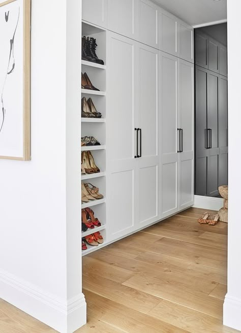 An elegant walk-in-wardrobe with French-oak flooring and white joinery. Built In Wardrobe Doors, Bedroom Built In Wardrobe, Beach Property, Bedroom Cupboards, Australian Style, Mcm House, Wardrobe Door Designs, Ocean Grove, Fitted Bedrooms