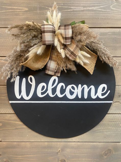 This signs will Welcome guests with a timeless touch all year round. Our neutral door sign features classic black and white lettering, adorned with rustic burlap and plaid ribbons. The delicate charm of pampas grass and white bunny tail accents adds a cozy, inviting feel. Let this welcoming sign make every season feel like home. Measures 18” Welcoming Sign, Pampas Gras, Feel Like Home, Plaid Ribbon, White Bunny, Bunny Tail, Creative Workshop, Door Sign, Pampas Grass