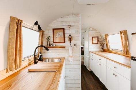 Photo 5 of 15 in A Beautifully Retrofitted 1969 Airstream Strikes a Chord With a Nashville Musician - Dwell Airstream Rv, Birch Cabinets, Airstream Remodel, Upper Kitchen Cabinets, Airstream Interior, Airstream Renovation, Hardwood Floors Dark, Vintage Airstream, Airstream Trailers