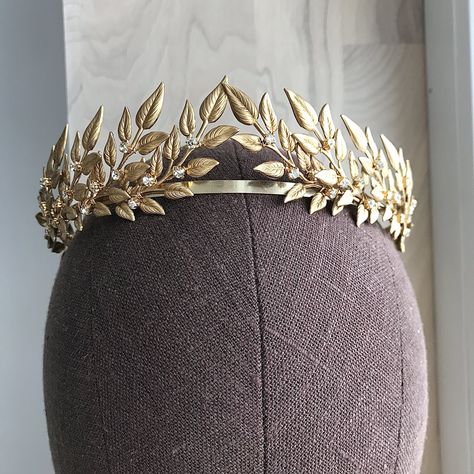 Excited to share the latest addition to my #etsy shop: Leaf crown gold, Bridal tiara, Greek wedding headband, Brass Leaves with small crystal BT-012 https://etsy.me/42Y7wzY #gold #classic #goldlaurelcrown #bridaltiara #grecianleafcrown #laurelheadpiece #greekweddingcro Diy Goddess Crown, Cakes Logo, Greek Crown, Gold Bridal Tiara, Gold Leaf Crown, Laurel Crown, Gold Bridal Crowns, Grecian Wedding, Small Crown