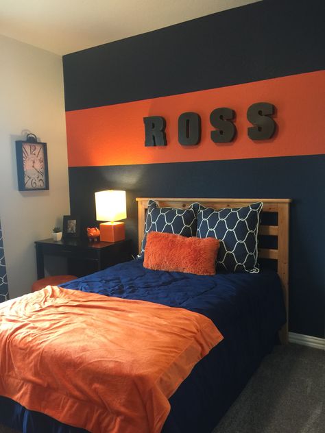 Red Boys Bedroom Ideas, Boys Orange Bedroom Ideas, Teen Room Decor For Boys Small Spaces Bedroom Ideas, Orange Boys Bedroom, Navy And Orange Bedroom, Boys Room Paint Ideas, Boys Bedroom Orange, Orange Boys Rooms, Boy Room Accent Wall