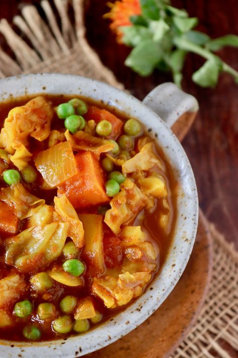 Vegetarian Cabbage Stew with Turmeric is as hearty as stew with meat, and as delicious as can be! Cooking with fresh turmeric is the key, and it's packed with tender vegetables in a rich blend of spices and tomatoes -- you will devour every last bite! #cabbage #turmeric #stew #vegan #vegetarian #tomato Turmeric Stew, Stew With Cabbage, Stew Vegan, Fresh Turmeric Root, Cabbage Stew, Vegan Stew, Turmeric Recipes, Fresh Turmeric, Light Salad