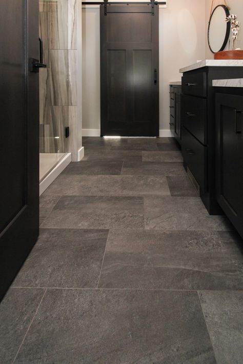 Grey Luxury Vinyl Tiled Bathroom Gray Tiled Bathrooms Ideas, Vinyl Tile Bathroom Floor, Luxury Vinyl Plank Bathroom, Luxury Vinyl Flooring Bathroom, Bathroom Floor Decor, Luxury Vinyl Tile Bathroom, Vinyl Tile Bathroom, Bathroom Flooring Trends, Tile Bathroom Floor