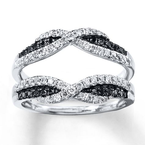 This dazzling enhancer ring for her features Artistry Black Diamonds® and ribbons of round white diamonds intermingling above and below an insert for her solitaire engagement ring. The enhancer ring is styled in 14K white gold and has a total diamond weight of 1/2 carat. Artistry Black Diamonds® are treated to permanently create the intense black color. (The solitaire ring is sold separately.) Diamond Total Carat Weight may range from .45 - .57 carats. Engagement Ring Wraps, Engagement Ring Enhancers, Kay Black, Black Diamond Wedding Rings, Enhancer Ring, Ring Wrap, Black Diamond Solitaire, Simulated Diamond Rings, Wedding Rings Solitaire