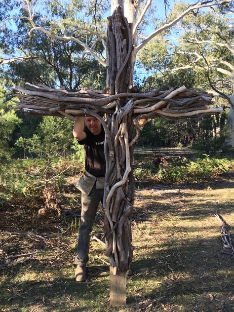 A large LifeSize cross we made from tree branches for our outdoor chapel! #cross #outdoorchapel #chapelinthewoods #easter #church #jesus #prayerstation Wood Crosses For Cemetary, Yard Crosses Wooden, Cross Made From Tree Branches, Christian Yard Decor, Outdoor Worship Space, Diy Outdoor Cross, Prayer Garden Ideas Backyards, Catholic Garden, Justice Band