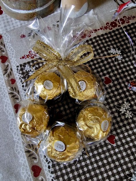 Ferrero Rocher Christmas wreath Ferraro Rocher Christmas Wreaths, Lindor Christmas Wreath, Chocolate Wreath Diy, Ferraro Rocher Wreaths, Ferrero Rocher Christmas Wreath, Christmas Favours Ideas, Ferrero Rocher Wreath, Christmas Grams, Ferrero Rocher Gift Ideas