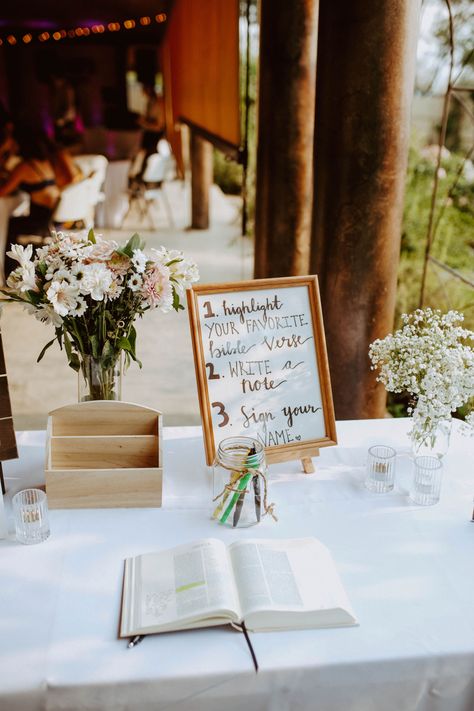 Sign A Bible Wedding, Bible At Wedding Reception, Wedding Decor You Can Use In Your Home, Wedding Bible Sign Guest Books, Fun Christian Wedding Ideas, Bible Verse At Wedding, Christian Wedding Table Decor, Boho Christian Wedding Decor, Bible As Guest Book Wedding Ideas