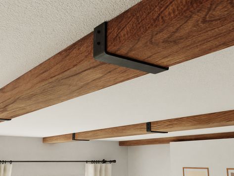 Wood Beam Lighting, Wood Beam Low Ceiling, Angled Ceiling Beams, Beam Brackets Metal, Faux Beam Ceiling Vaulted, Decorative Ceiling Beams, Basement Beam Cover Ideas, Faux Beams In Kitchen, Support Beam Cover Ideas