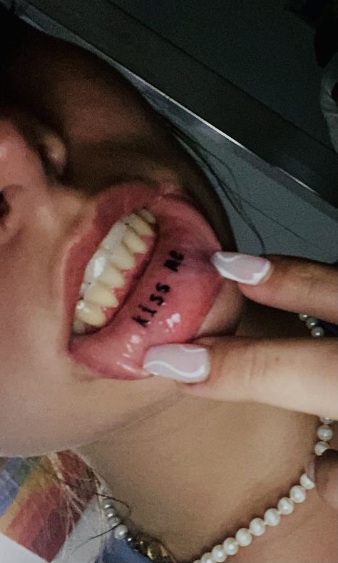 Lip tattoo idea kiss me Cool Lip Tattoos Ideas, Tattoo On Lips Ideas, Make Me Lip Tattoo, Inner Lip Tattoo Aesthetic, Inside Mouth Tattoo, Tounge Tattoo Ideas, Inside Lip Tattoos Ideas, Underlip Tattoos, Lower Lip Tattoo