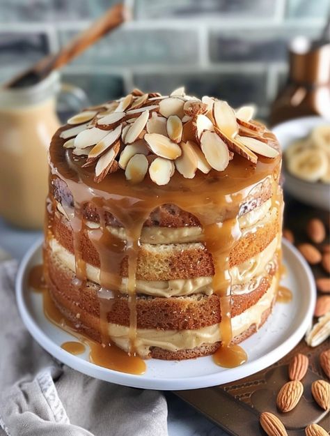 Banana Almond Caramel Layer Cake  🍰    Ingredients:🍌 Cake Layers:🍌 - 2 cups all-purpose flour - 1 cup almond flour - 1/2 cup granulated sugar - 1 cup unsalted butter, softened - 6 large eggs - 2 tsp vanilla extract - 1 tsp baking powder - 1/2 tsp salt - 1 cup milk Almond Caramel Cake, Caramel Layer Cake, Almond Caramel, Hot Cake, Dessert Cookbooks, Cake Layers, Caramel Cake, Banana Cake, Cake Ingredients