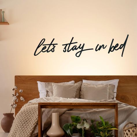 PRICES MAY VARY. Elevate Your Decor: Add a touch of rustic elegance to any space with our bedroom wall decor set. The charming "let's stay in bed" design is perfect for your bedroom, bathroom, dressing room, dorm, or office, bringing warmth and coziness to your surroundings. Sturdy Materials: Crafted with high-quality metal, this above bed wall decor is sturdy and resistant to breakage. The smooth black surface is fade-resistant and waterproof, ensuring that it remains looking great for a long t Over The Bed Wall Decor For Couples, Over Bed Signs, Bed Iron, Behind Bed Wall Decor, Above Bed Wall Decor, Bedroom Wall Decor Above Bed, Wall Decor Above Bed, Metal Bedroom, Above Bed Art