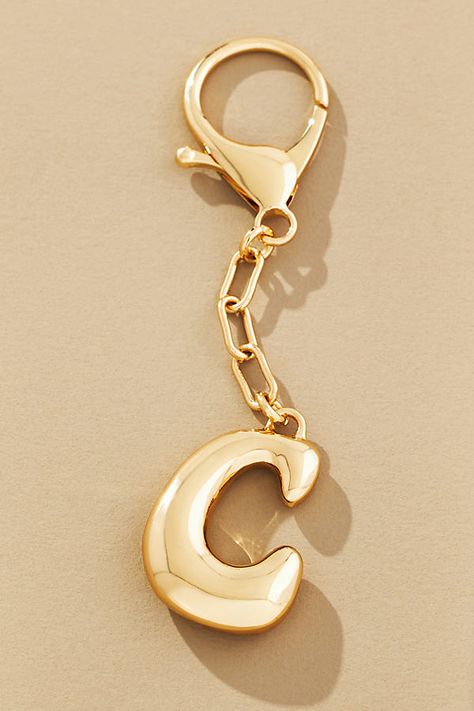 Charming new-trend alert: jewelry for your bag. Bursting with personality, this monogram makes a great gift (for you + a friend)! | Bubble Letter Monogram Bag Charm by Anthropologie, Women's, Zinc Bubble Letter Jewelry, Unique Promotional Products, Shopping Wishlist Ideas, Thoughtful Friend Gifts, Bags With Charms Aesthetic, Women's Christmas Gift Ideas For Women, Cute Backpack Keychains, Gift Basket For Friends Birthday, Cute Key Chains Aesthetic