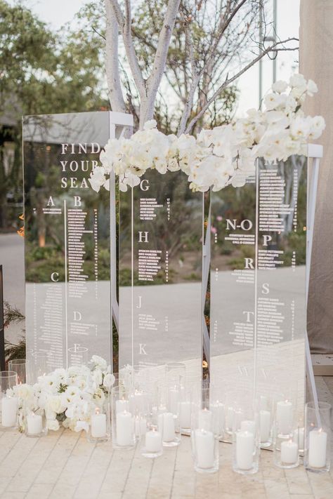 assigned seating inspo Floral Wall Seating Chart, Wedding Decor Destination, Wedding Seat Card Ideas, Gold Acrylic Seating Chart Wedding, Luxury Seating Chart Wedding, All White Summer Wedding, Luxury Wedding Seating Chart, Simple Modern Backdrop, All White Decor Wedding