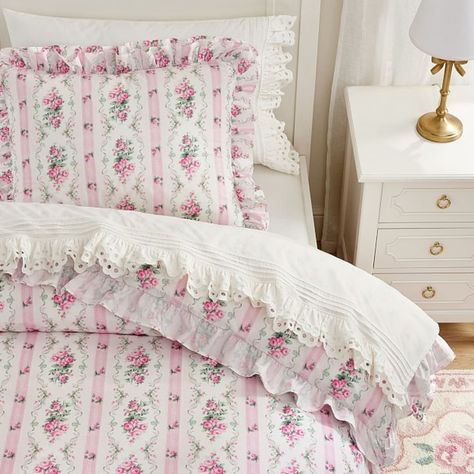 Crafted from soft, durable organic cotton, this duvet cover brings beautiful blooms and color to their bedding. The breathable layer is trimmed with ruffles for an elegant touch and makes a cozy piece for any time of year. Pair with the matching shams for a cohesive set. Designed exclusively for Pottery Barn Kids by lifestyle brand LoveShackFancy. DETAILS THAT MATTER Made of 100% cotton percale with a digitally printed design. Percale weave is a tightly woven weave, which gives the fabric a soft matte finish while providing durability and wears well over time. Duvet reverses to the same print. Duvet cover and shams is finished with velvet tie closures to keep the duvet in place. Twin size duvet is finished with 6 buttons to keep duvet in place. Full/Queen duvet is finished with 8 buttons t Baby Pink Bedding, Pottery Barn Bedrooms, Chic Bedding Sets, Fancy Bedroom, Pottery Barn Bedding, Shabby Chic Bedding, Duvet Cover Pattern, Pink Bedding, Cute Room Decor