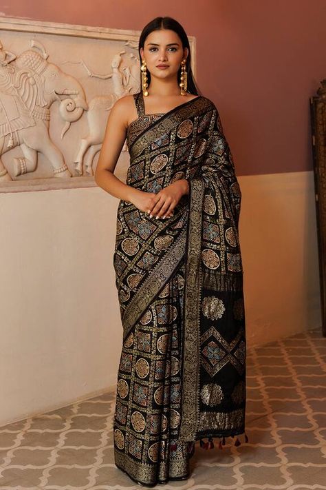 Black saree in a gharchola pattern with floral geometric ajrakh prints and woven zari floral vine patterns. Comes with an unstitched blouse fabric. - Aza Fashions Ajrakh Modal Silk Sarees, Sarees Black, Ajrakh Sarees, Saree Wearing Styles, Saree Wearing, Ajrakh Prints, Fancy Sarees Party Wear, Black Saree, Floral Geometric