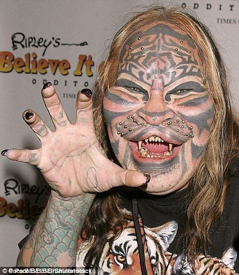 Dennis Avner, also known as the Stalking Cat, was a Nevada man famed for his extreme body ... Extreme Body Modification, Wierd People, Human Oddities, Epic Tattoo, Bad Tattoos, Body Modification, Foot Tattoo, Body Modifications, Foot Tattoos