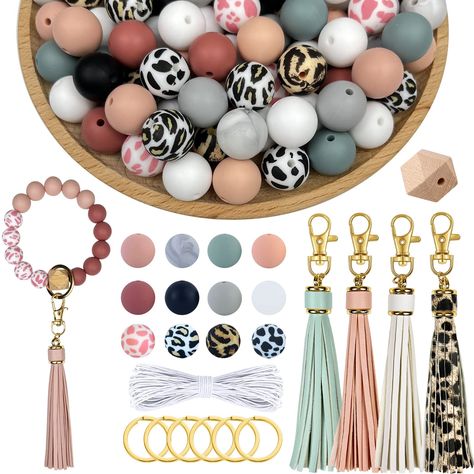 PRICES MAY VARY. Good Value Silicone Beads Kit: This kit includes 100pcs round silicone beads, 6pcs wooden beads, 4pcs faux leather tassels, 6pcs keyrings and hooks, 26 feet long elastic strings; making it a must-have for keychain bracelet crafts 15mm Large Beads: All the silicone beads we provide are 15mm in diameter, a more commonly used size for brecelets. Be aware that some others are only 12mm and will take more beads to make a string Create Freely: There're so many ideas with these beads, Small Business Jewelry, Business Jewelry, Beads Kit, Rubber Bead, Keychain Making, Keychain Bracelet, Large Beads, Beadable Products, Bracelet Diy