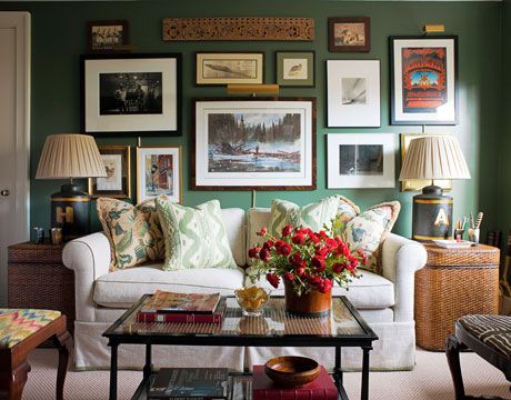 Home Office  Dark green walls — Peale Green by Benjamin Moore — are a rich backdrop for the owners' eclectic mix of photographs and art in the home office. A cane coffee table from John Rosselli, woven side tables from Pottery Barn, and the vintage concert poster add to the casual vibe.  Ashley Whittaker  House Beautiful Feb. 2013 Dark Green Walls, Revere Pewter, English Decor, Green Walls, Chic Living Room, Winter Home Decor, Green Rooms, Boho Home, A Living Room