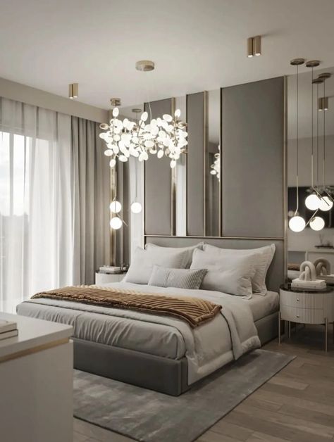 Luxury bedroom with clustered light feature | If there’s one room of the house that should feel luxurious, it��’s the bedroom. Adding some touches of luxury to your bedroom can it feel like you’re coming home to a luxury hotel every night.If you’re looking for inspiration for how you can make your bedroom more luxurious, look no further. In this post, I’ve compiled 34 luxury bedrooms to use as inspiration. Grey Luxury Bedroom, Luxury Apartment Bedroom, Bedroom Inspirations Master Cozy, Black Luxury Bedroom, Bedroom Inspirations Master, Bedroom Color Combination, Luxe Bedroom, Gold Bedroom, Gorgeous Bedrooms