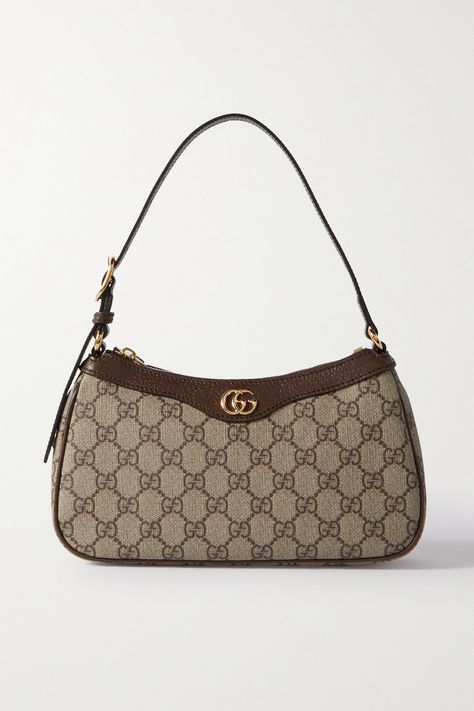 Gucci's bag is part of the 'Ophidia' collection, coveted for its timeless silhouettes. It's been crafted in Italy from printed coated-canvas, trimmed with textured-leather and embellished with the signature, gold-tone 'GG' motif. There's just enough room inside for a few essentials. Tas Gucci, Dream Bags, Luxury Bags Collection, Mode Zara, Gucci Handbag, Handbag Essentials, Gucci Ophidia, Tas Fashion, Girly Bags