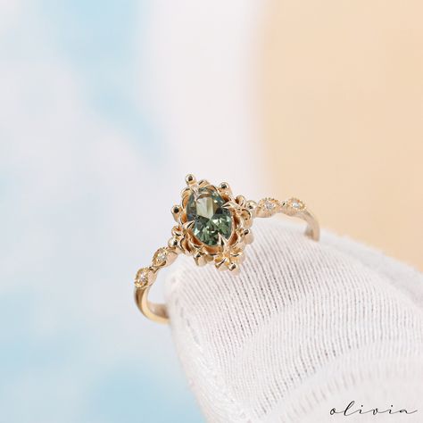 Discover the timeless allure of our Vintage Green Sapphire Engagement Ring, a true embodiment of elegance and vintage charm. Crafted in exquisite 14K and 18k options rose, white, yellow gold, this dainty piece features a brilliant green sapphire, resonating with September's birthstone. Adorned with diamonds and showcasing vintage style, this fine estate ring is designed for a woman seeking both sophistication and a touch of nostalgia. F E A T U R E S 💎 D I A M O N D Carat: 0.03 Quality: VS1 Col Gold Vintage Rings, Vintage Splendor, Green Engagement Rings, Art Deco Rings, Deco Rings, Art Deco Sapphire Ring, Rings Dainty, Pretty Engagement Rings, Green Sapphire Engagement