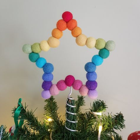 Featuring a newly updated frame and coil for Christmas 2023! Rainbow Felt Ball Star  Christmas Tree Topper ⭐Description This colourful star is handmade at my table in sunny Yorkshire, from 2cm felt balls threaded onto a wire frame so the star looks the same from the front or back. The wire spiral enables this star to be placed on top of a christmas tree. The star comes wrapped in tissue paper and sealed with a button sticker. Perfect to send as a small gift or to treat yourself.  As each tree is different, some adjustments of the wire coil may be needed to fit your star to your tree.  Custom orders are accepted so if you would like a star in a different colour, then please select 'custom colours' and add your colours into the order notes. Please select the colours from the photo in the des Christmas Tree Topper Colorful, Colourful Christmas Aesthetic, Colourful Christmas Decor, Colorful Christmas Diy, Felt Trees Diy, Diy Colorful Christmas Decor, Rainbow Christmas Decor, Whimsical Christmas Decor Ideas, Pompom Christmas Tree