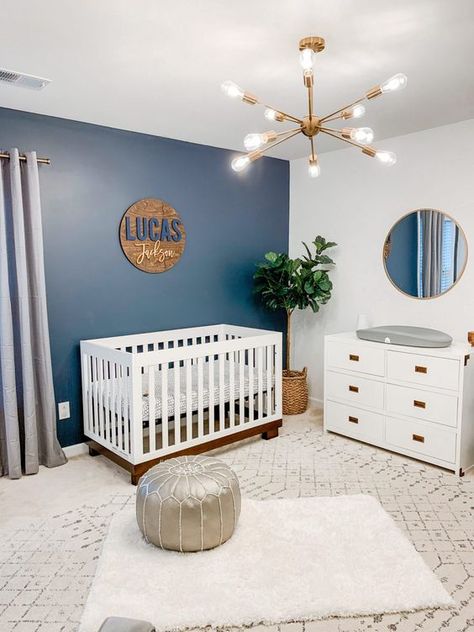 Picture of a stylish modern nursery with a blue wall Navy Wallpaper Accent Wall, Wallpaper Accent Wall Nursery, Accent Wall Nursery, Blue Accent Wall, Navy Nursery Boy, Navy Blue Nursery, Name Sign For Nursery, Nursery Accent Wall, Blue Accent Walls