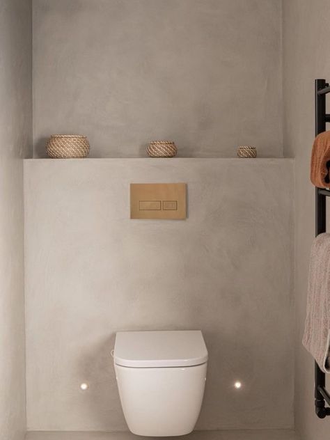 We love this natural plaster look by our clients Dust Architects.
⁠
The natural tones of the plaster and the texture effect give a clean but warm ambiance.⁠
⁠
Combined with gorgeous brushed brass fixtures, white ceramics and very on-trend rattan ornaments it creates a beautifully serene space.⁠

#interiorarchitect ##interiordesigner #masterbathroom #bathroomdesign #interiorinspiration #minimalinterior #bathroominspiration #rattan #instahome #instastyle #bathroomrenovation #ensuite Concrete Effect Paint, Small Toilet Room, Guest Toilet, Downstairs Toilet, Toilet Room, Small Toilet, Bathroom Design Inspiration, Downstairs Bathroom, Bathroom Inspiration Decor